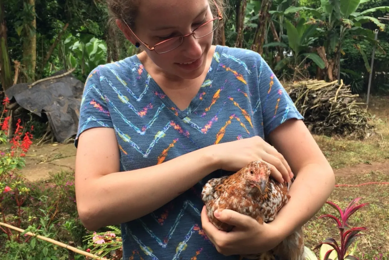 veterinary student holding a chicken