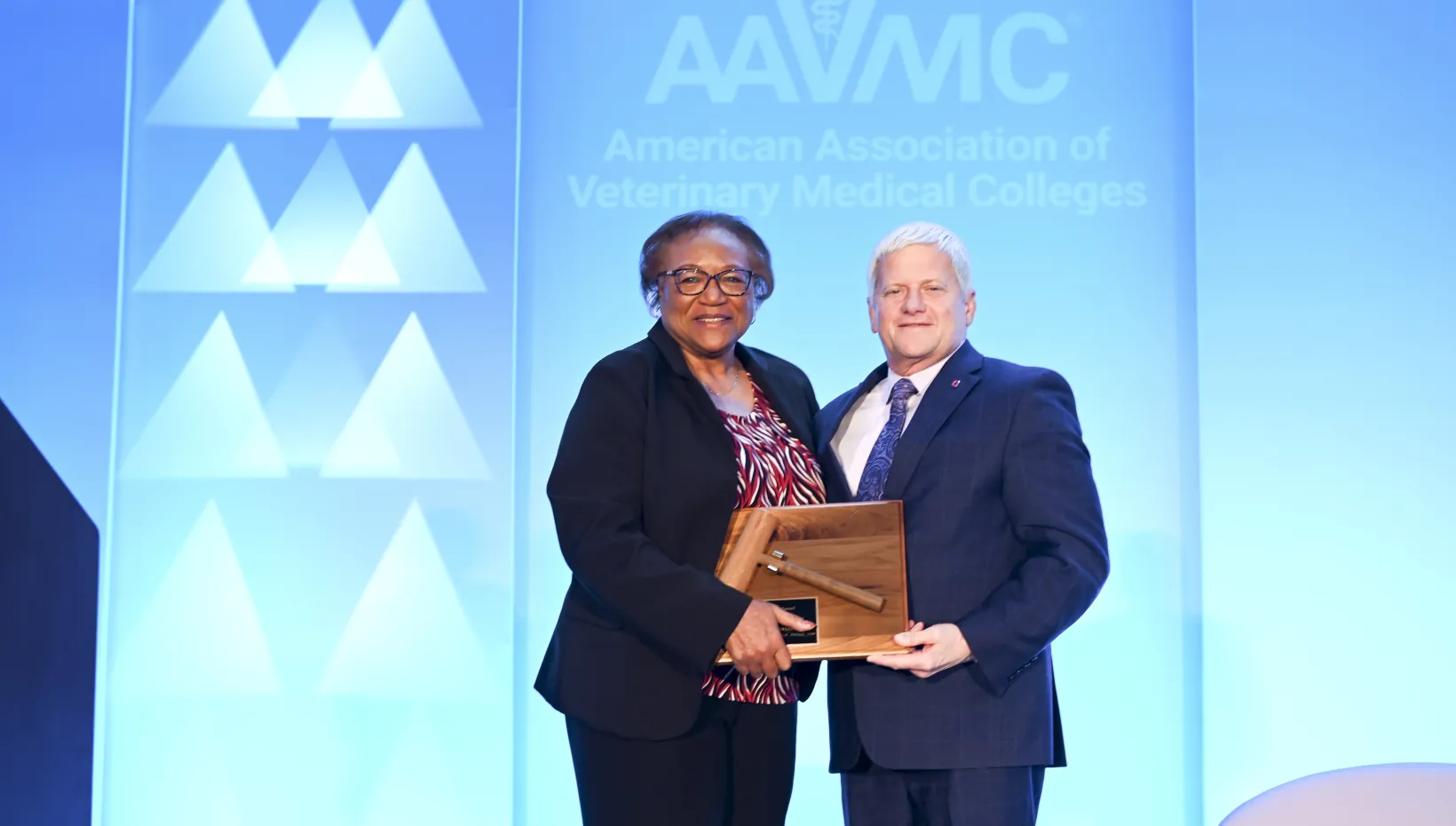 Dr. Perry passing the gavel to Dr. Moore for the AAMVC presidency 
