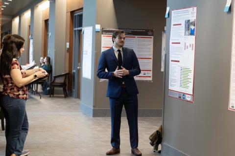 student presents research during research day