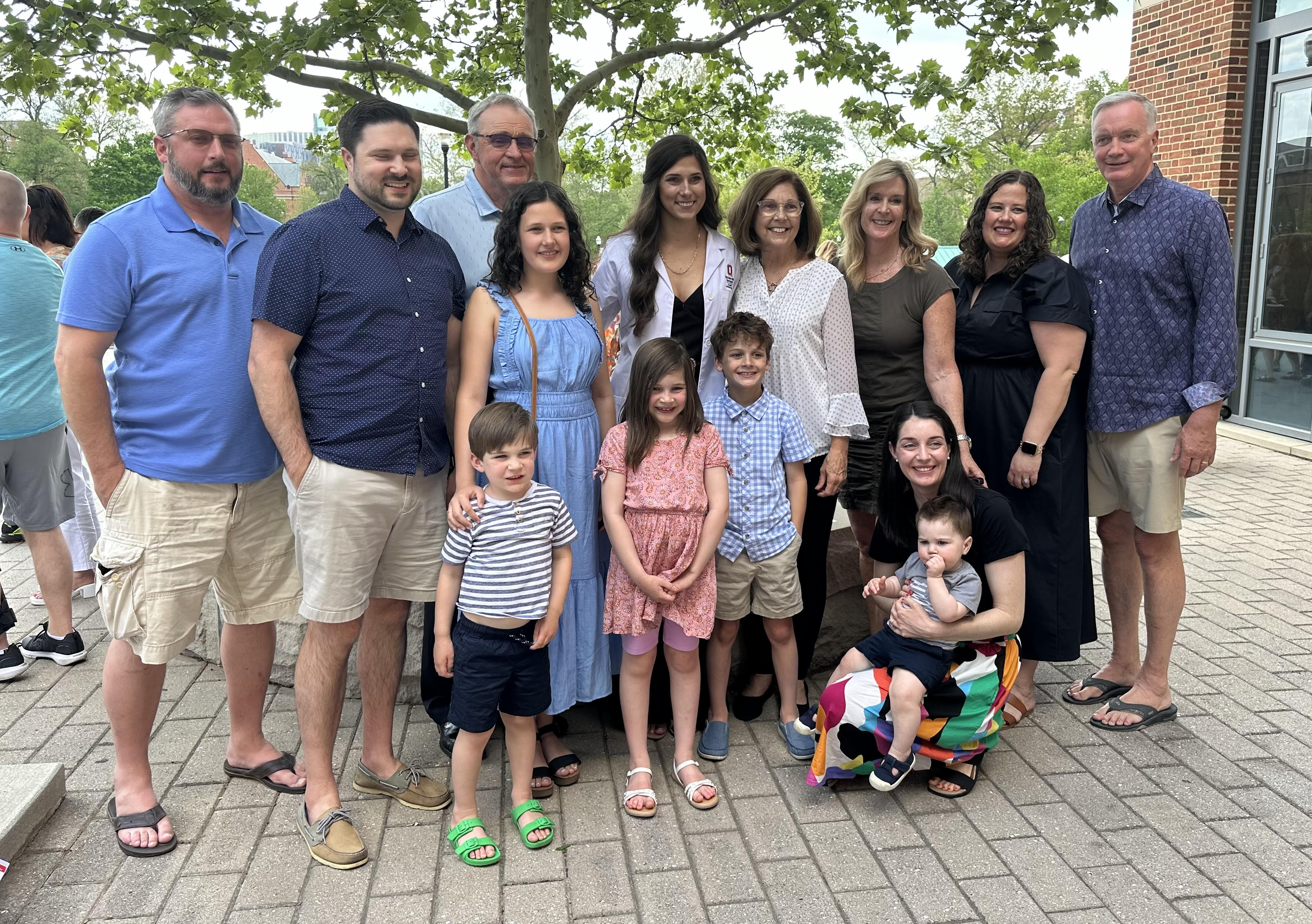 Elizabeth Porteus, DVM Candidate, Class of 2025, (center) with her family at the 2024 White Coat Ceremony. 