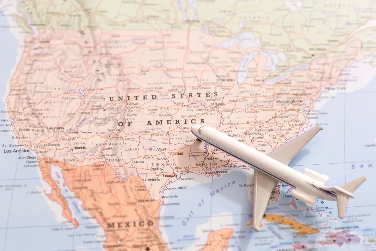 model airplane over map of usa