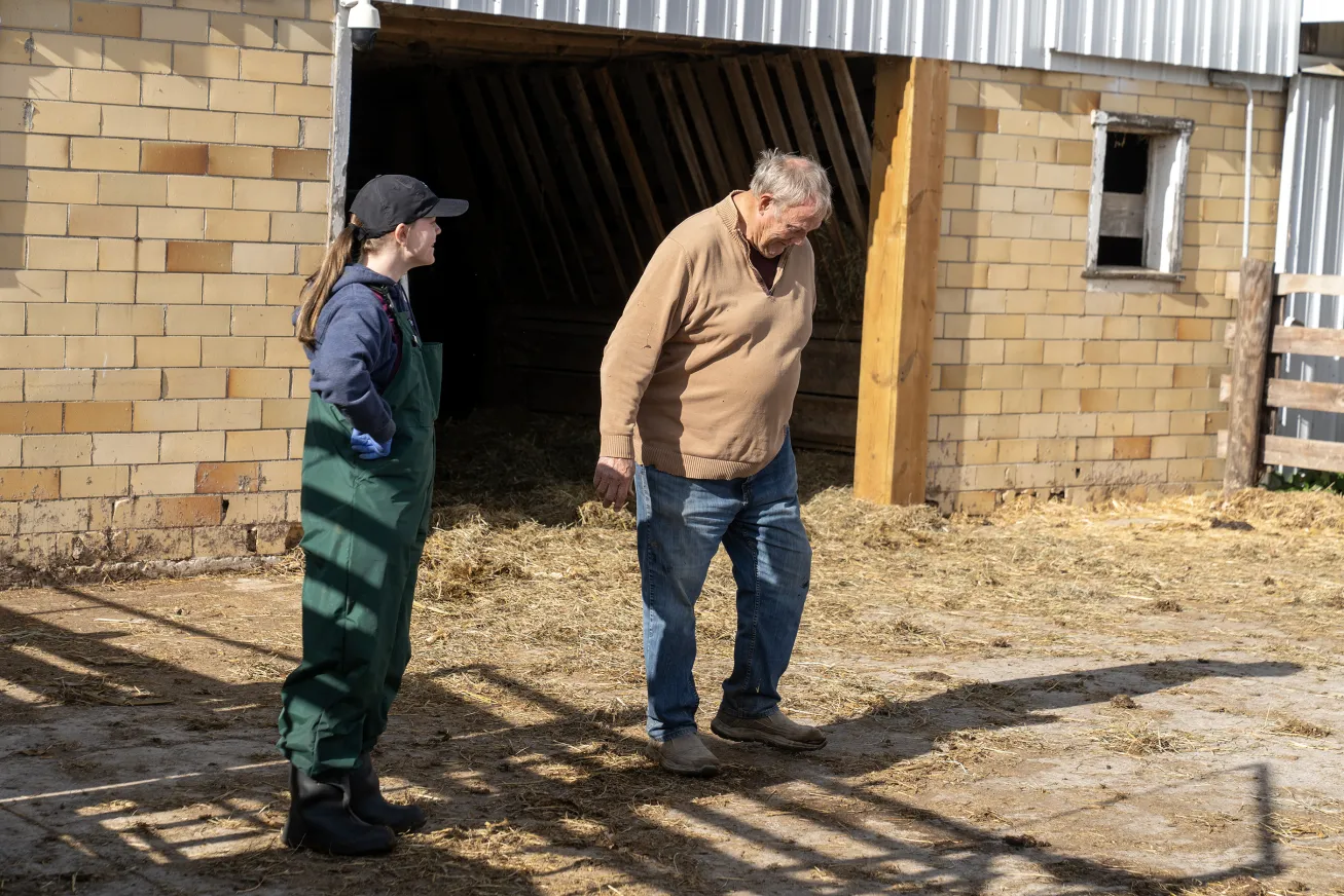 Bockey and Parthemore laugh about one of the cows that was a bit of a troublemaker in that morning's exam