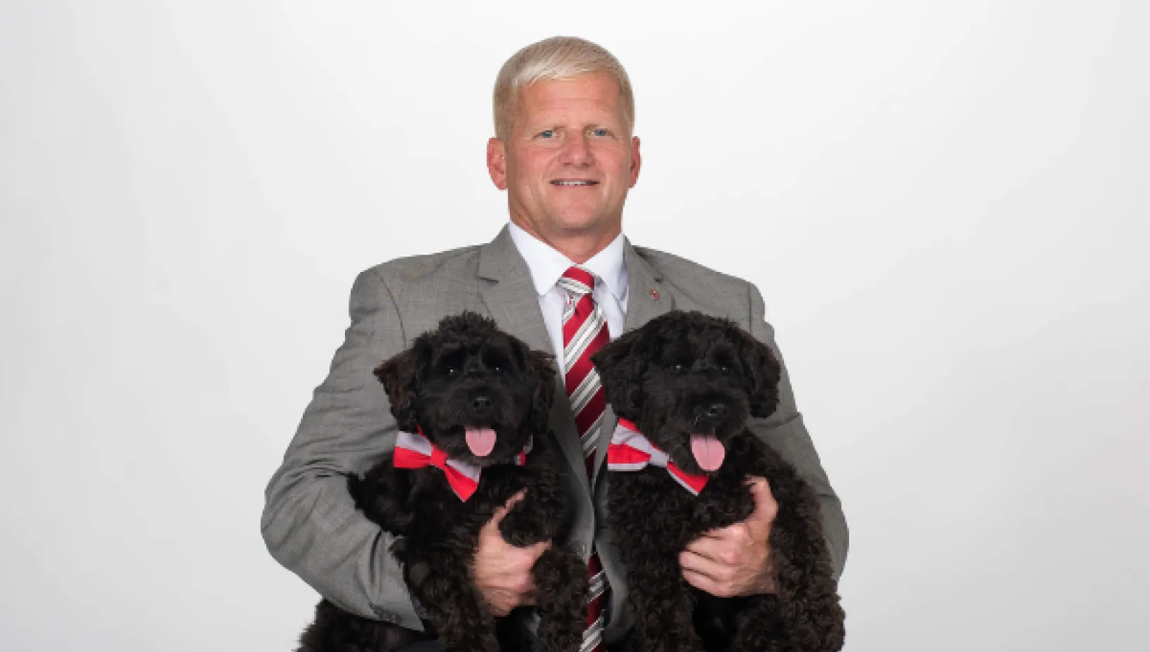 Dean Rustin Moore posing with his two dogs