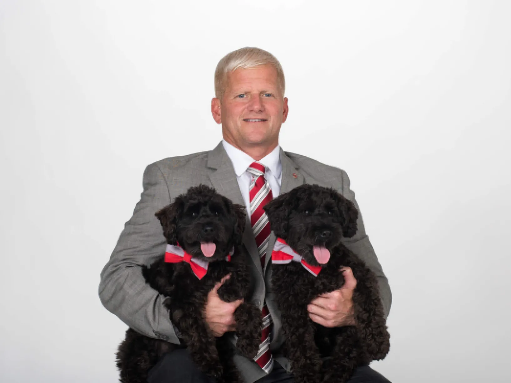 Dean Rustin Moore posing with his two dogs