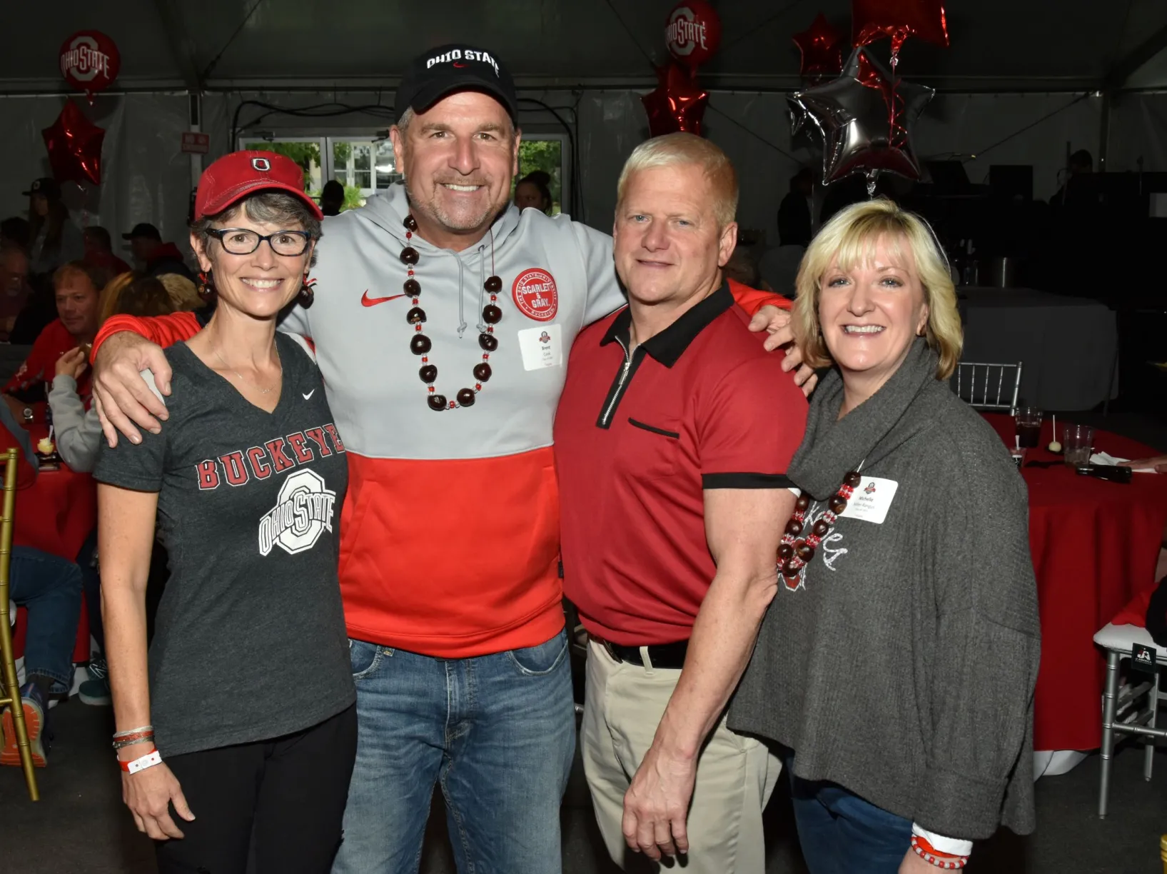 Group shot of four people at the CVM Homecoming event