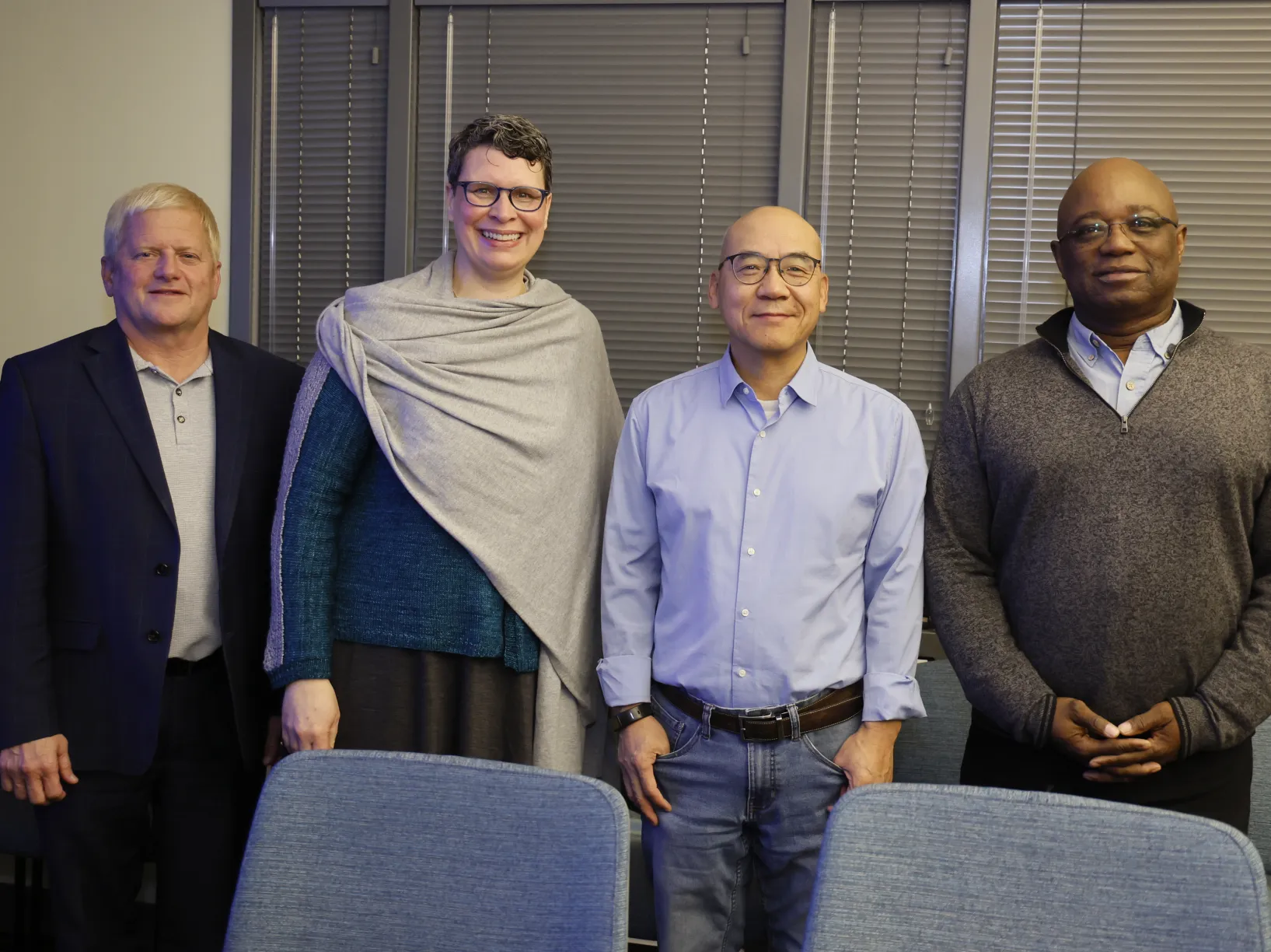 Rustin Moore, Helen Malone, Shan-Lu Liu, Prosper Boyaka pose at surprise ceremony