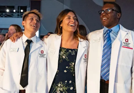 Students earning their white coat