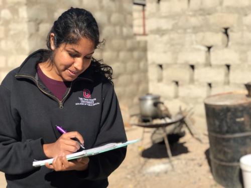Student taking notes in south africa for VPH program