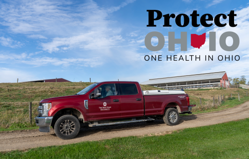 photo of red veterinary truck on a farm with the words Protect One Health in Ohio