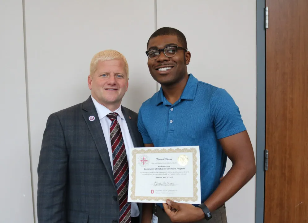 dean rustin moore awarding kenneth burris 