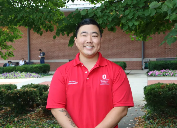 Jeffrey Kim in a red polo