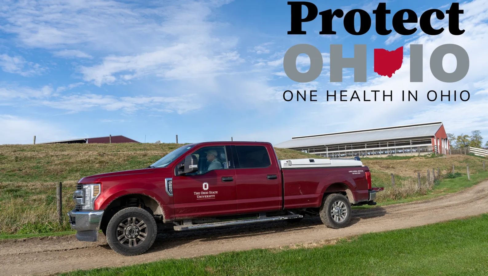 photo of red veterinary truck on a farm with the words Protect One Health in Ohio