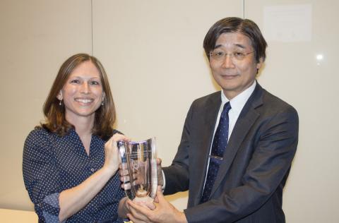 Dr. Masao Matsuoka receives Career Award crystal from Center for Retrovirus Research member Dr. Amanda Panfil 