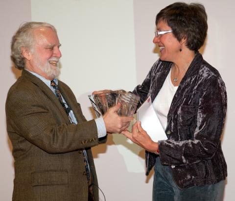 Dr. Stephen Goff (left) receives Career Award crystal from Center for Retrovirus Research Associate Director Dr. Kathleen Boris-Lawrie.