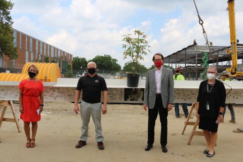 faculty at the topping off ceremony for the SOCC 