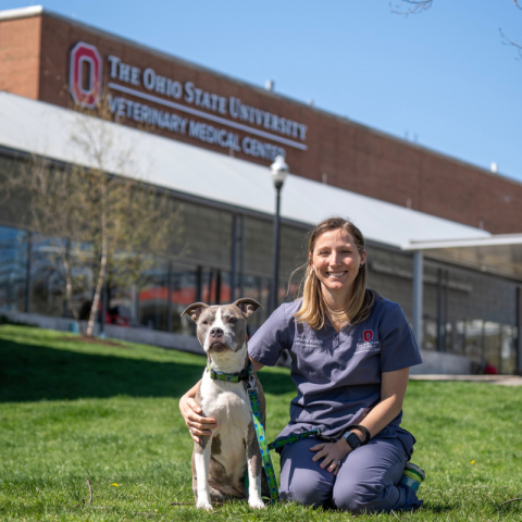 Jenessa Winston with her dog in front of the Veterinary Medical Center