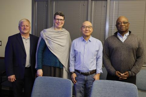 Rustin Moore, Helen Malone, Shan-Lu Liu, Prosper Boyaka pose at surprise ceremony