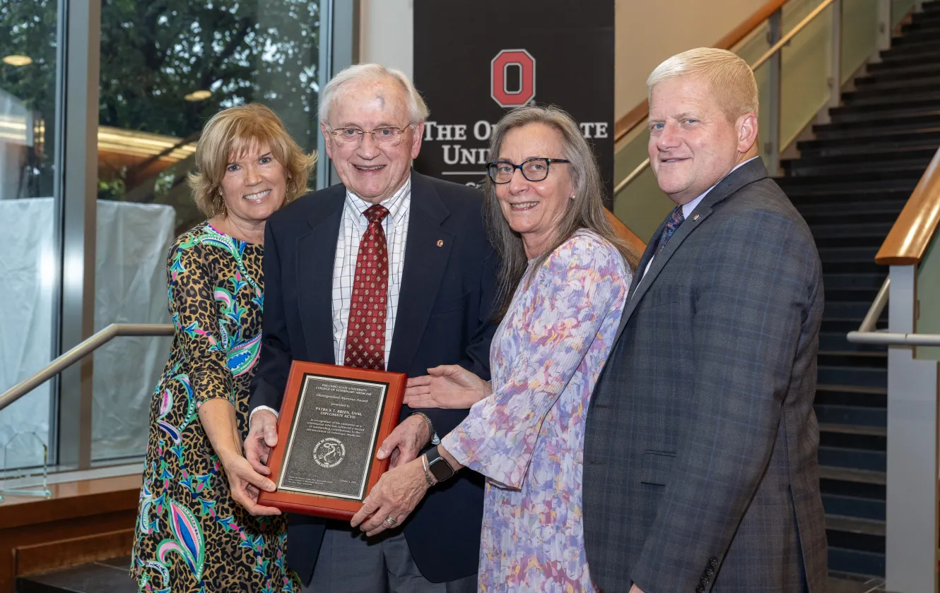 nominators with honoree and dean at alumni awards event