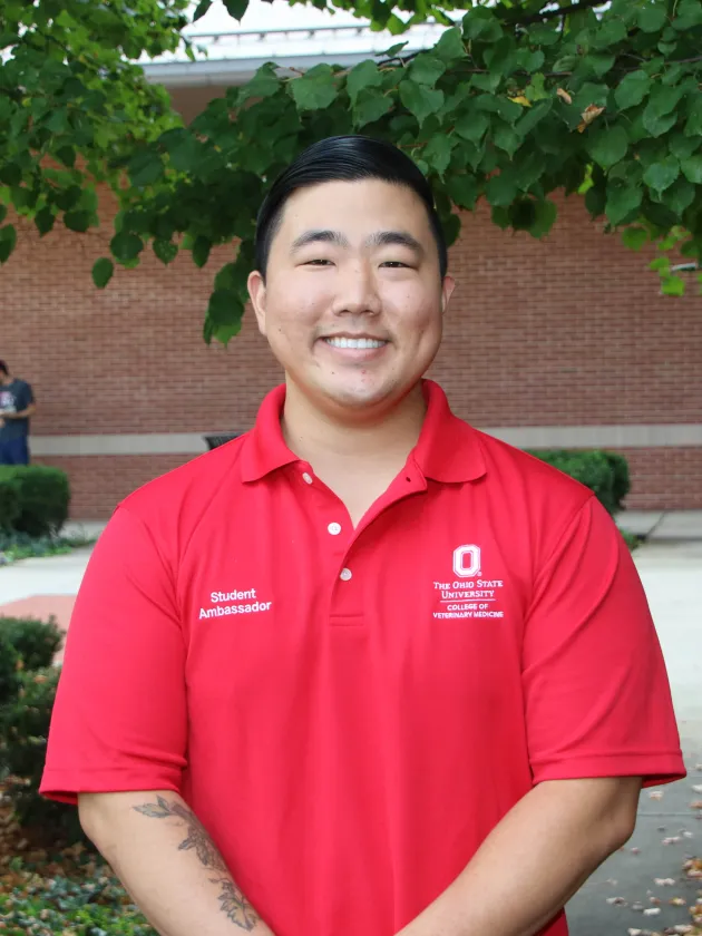 Jeffrey Kim in a red polo